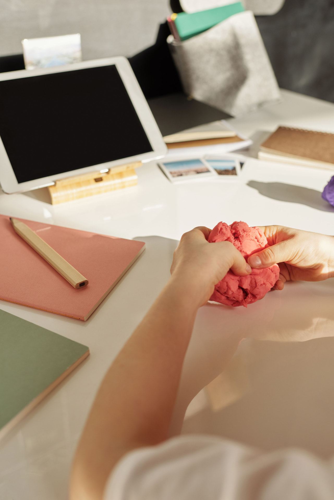 Young child using sensory play dough during an occupational therapy session